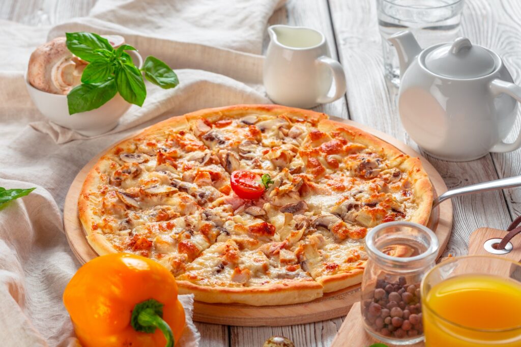 Delicious fresh pizza served on wooden table